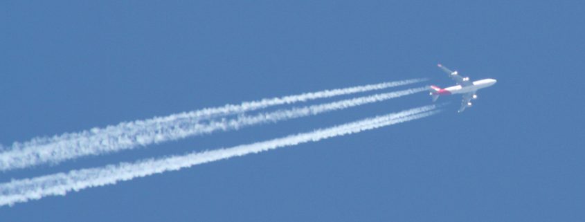 Airplane with contrails